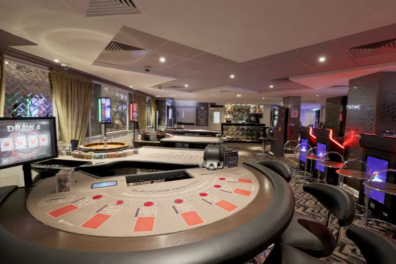 Blackjack and roulette tables inside Genting Casino Brighton