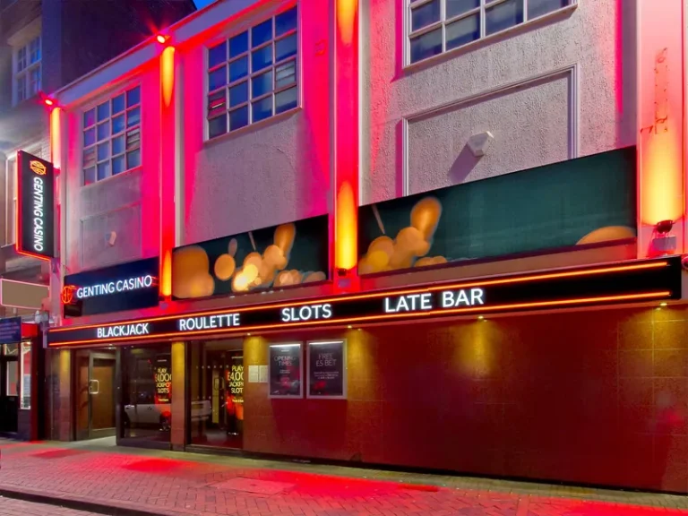 Genting Casino Leicester entrance at night with red exterior lighting