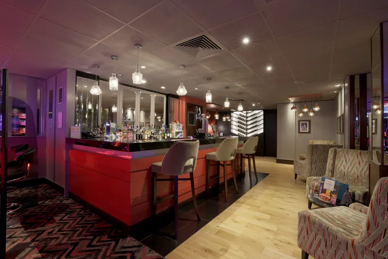 Bar area inside Genting Casino Leicester with lounge seating