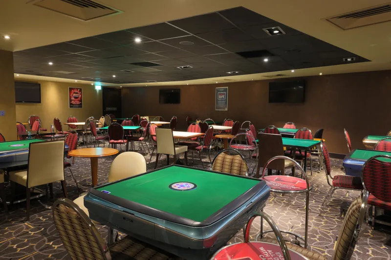 Genting Casino Manchester card room with green tables