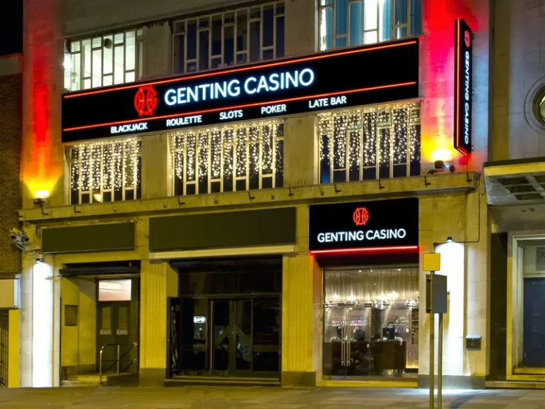 Exterior of Genting Casino Plymouth at night with illuminated signage