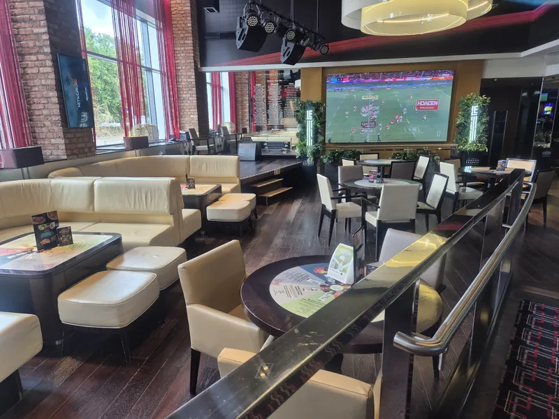 Bar lounge with large screen at Genting Casino Reading