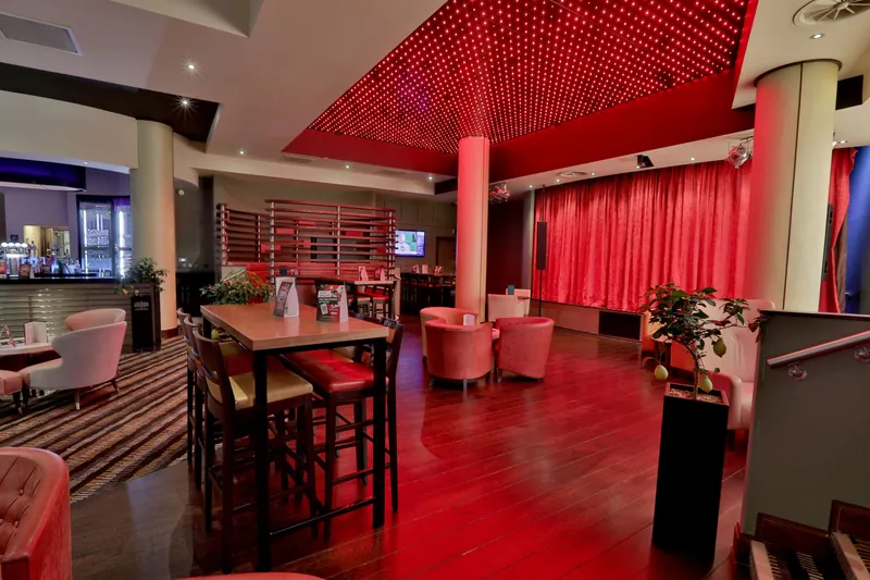 Red lounge area inside Genting Casino Riverlights Derby
