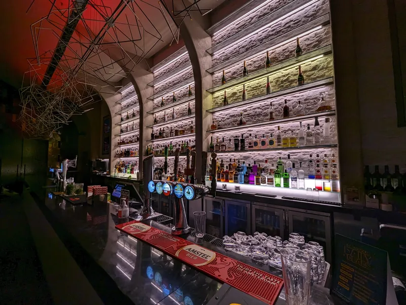 Backlit bar area at Genting Casino Stratford