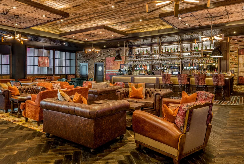 Lounge bar with leather sofas at Genting Casino Stratford