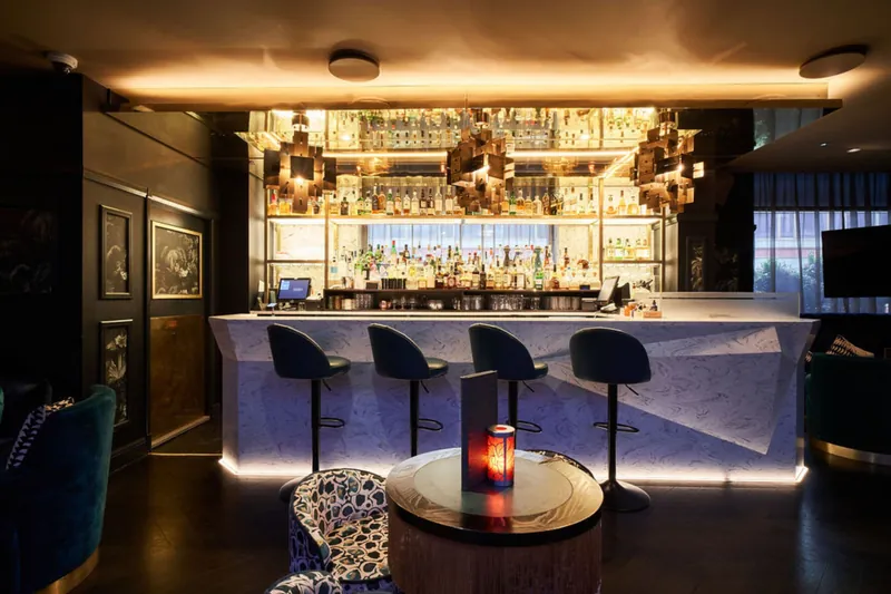 Illuminated bar inside The Colony Club