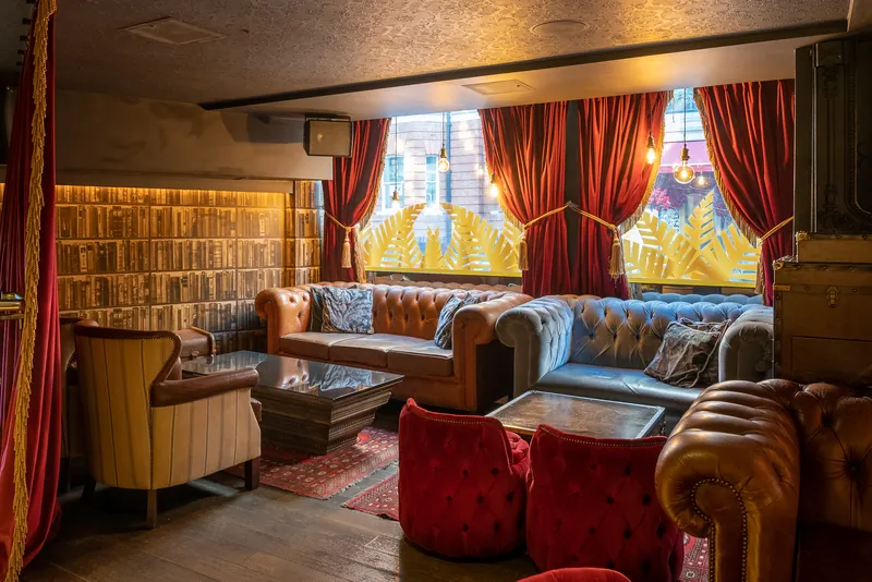 Lounge area with sofas inside The Palm Beach Casino