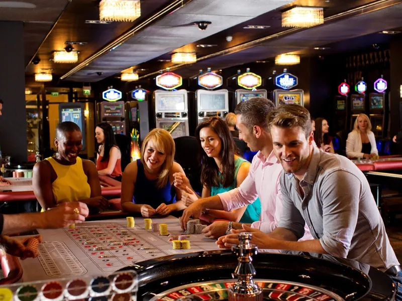 Players at a table games area inside a UK casino
