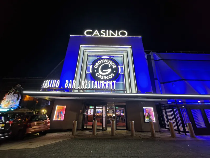 Illuminated entrance to Grosvenor Casino Blackpool at night