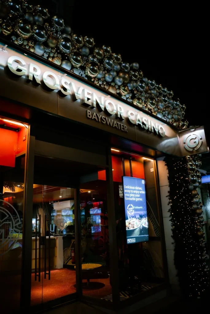 Casino entrance at night at Grosvenor Casino London Bayswater